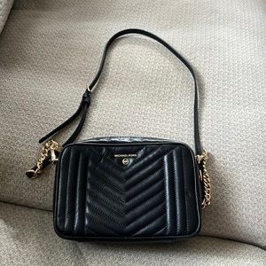 Michael Kors black and gold crossbody bag